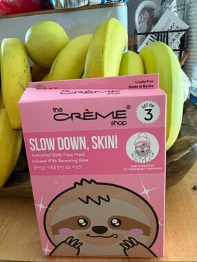 the CRÈME Shop Slow Down, Skin! Animated Sloth Face Mask - Pink (Set of 3)